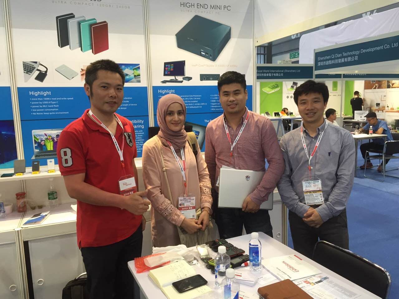 Trade show photo with customers at booth