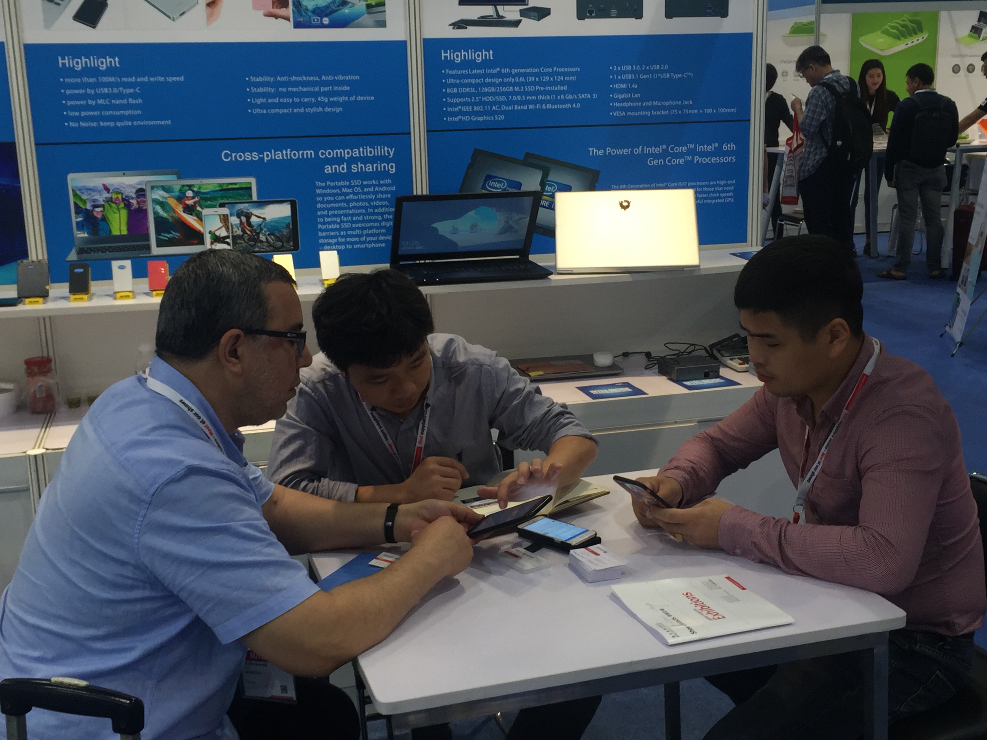 Booth meeting discussing product details